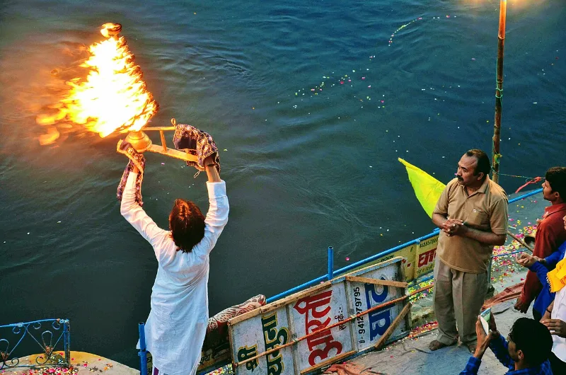 Sacred twilight evening prayer Sandhya Aarti at the Yamuna river ghats in Vrindavan